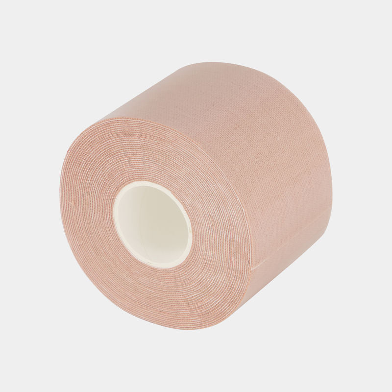 Adhesive Body Tape Roll in Nude. Flat lay front view