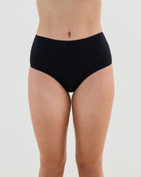 Model wears Cotton And Lace Full Brief in BLACK. On body front view