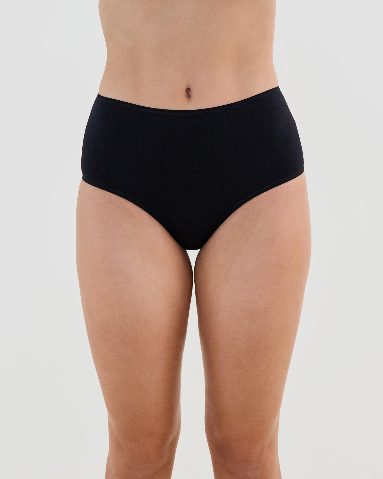 Model wears Cotton And Lace Full Brief in BLACK. On body front view