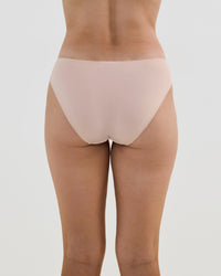 Model wears Lacey Bikini in LATTE. On body back view