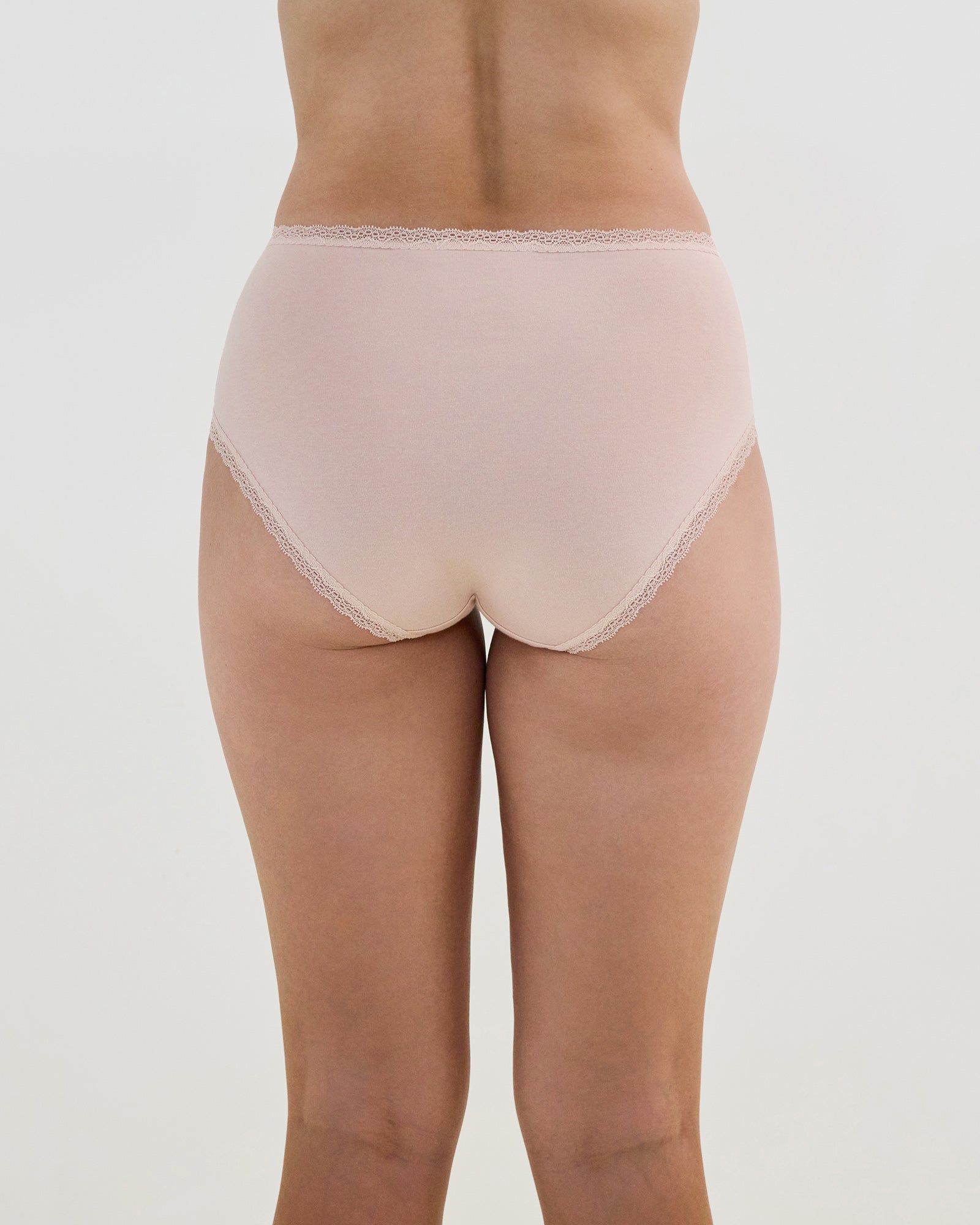 Model wears Stretch Cotton Full Brief in LATTE. On body back view