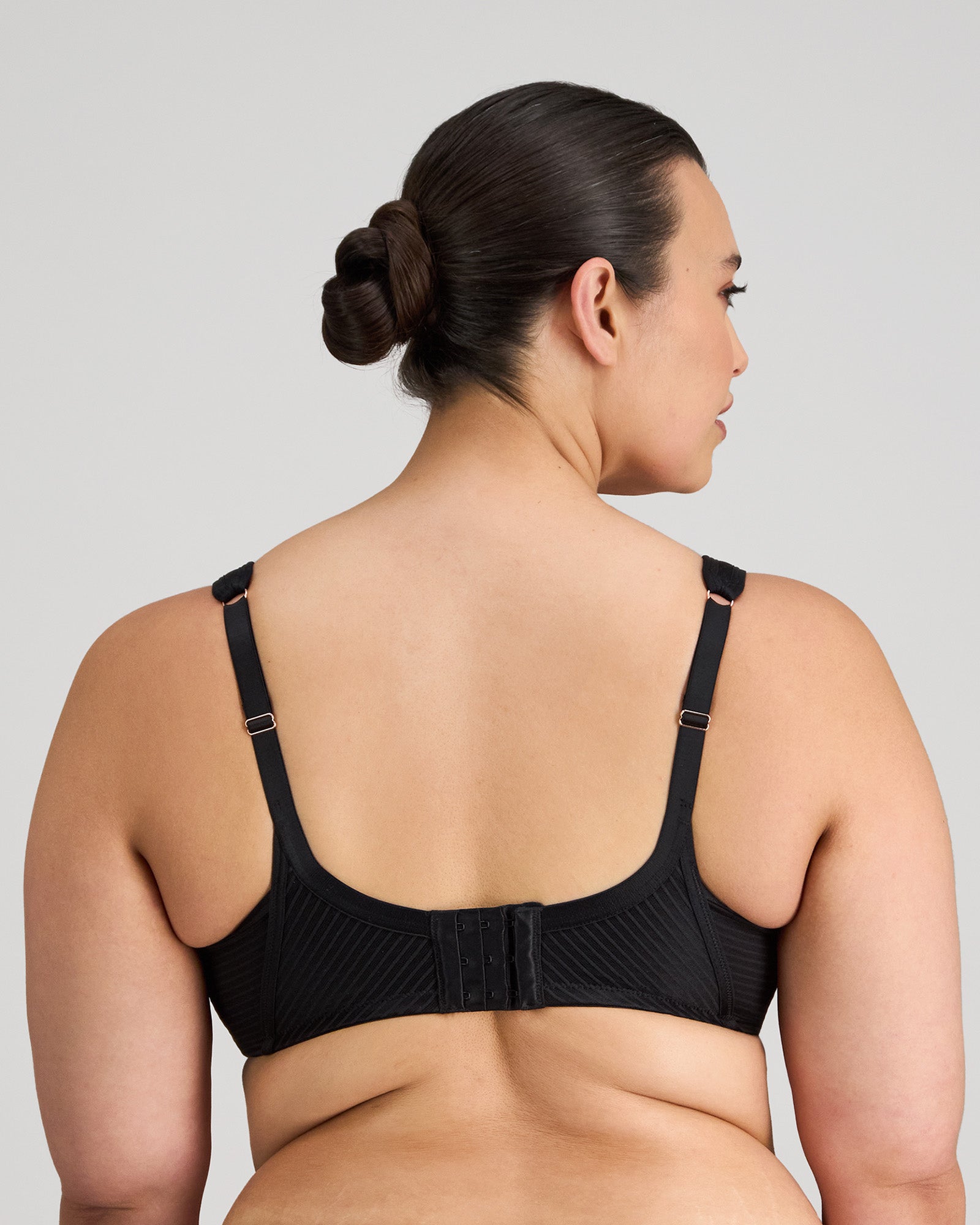 Model wears Perfect Lines Contour Bra in BLACK. On body back view
