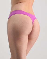 Seamless Soft Thong in RADIANT ORCHID. Flat lay back view