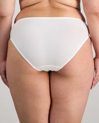 Model wears Coral High Cut Brief in WHITE. On body back view