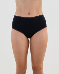Model wears Stretch Cotton Full Brief in BLACK. On body front view