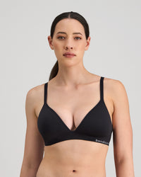 Model wears Simply Seamless Wire Free Bra in BLACK. On body front view