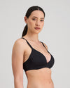 Model wears Simply Seamless Wire Free Bra in BLACK. On body side view