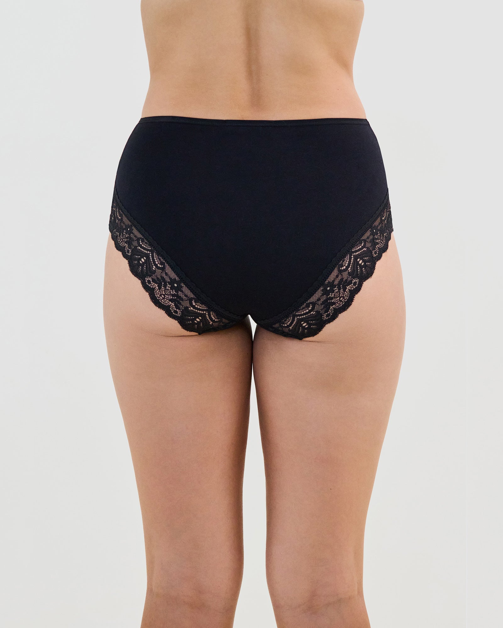 Model wears Cotton And Lace Full Brief in BLACK. On body back view