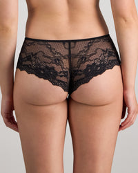 Model wears My Fit Lace Brazilian in BLACK. On body back view