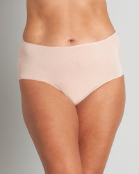 Model wears Au Naturel Full Brief in LATTE. On body front view