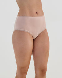 Model wears Stretch Cotton Full Brief in LATTE. On body side view