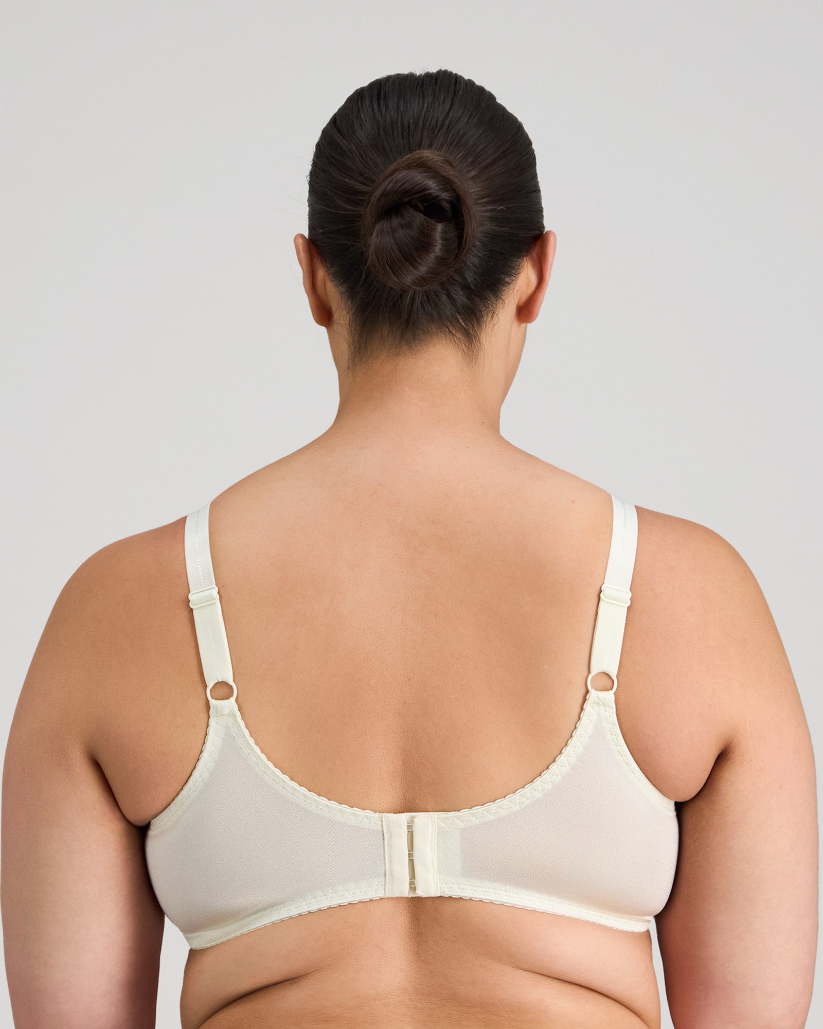 Model wears Classic Underwire Underwire Bra in IVORY. On body back view