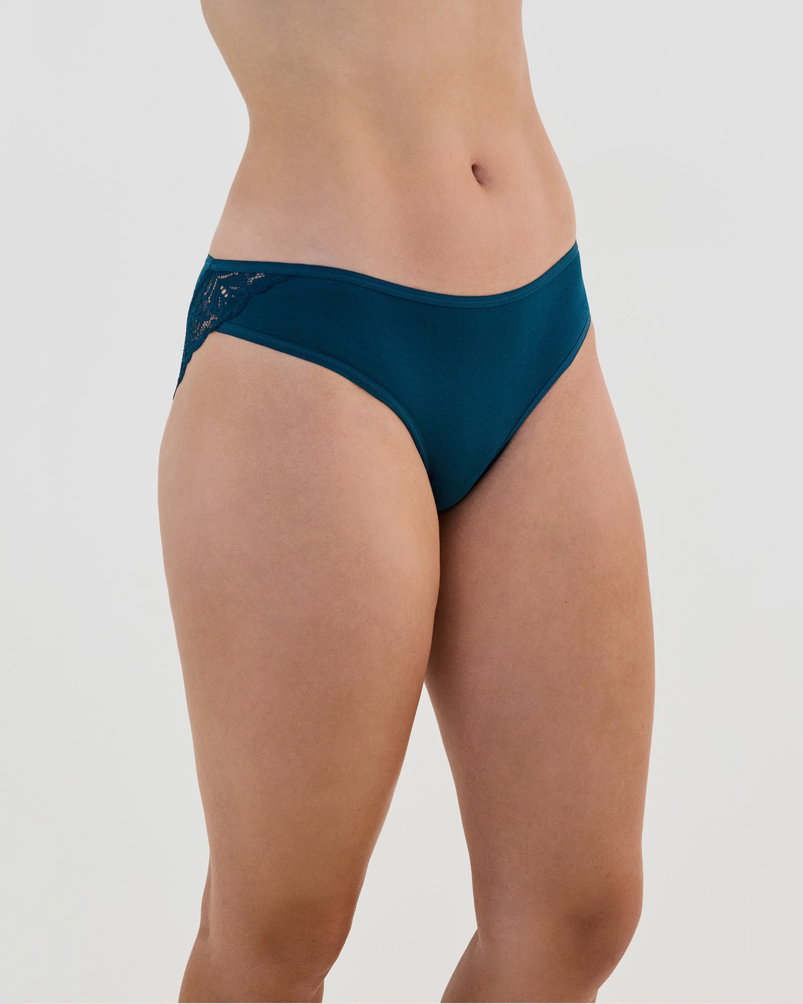 Model wears Cotton And Lace Bikini in REFLECTING POND. On body side view