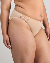 Model wears Coral High Cut Brief in LATTE. On body side view