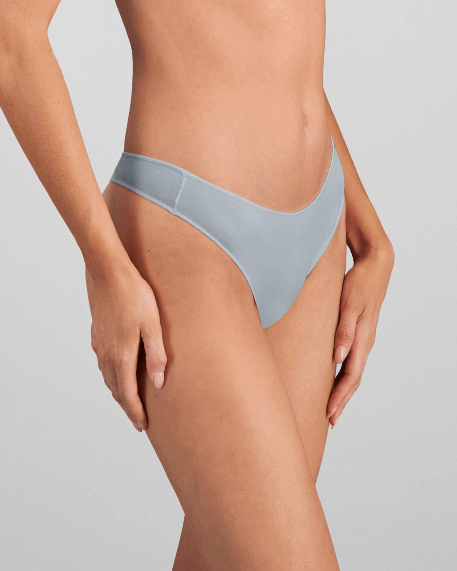 Model wears Au Naturel Thong in SLATE. On body front view