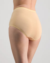 Model wears Freedom Full Brief in Nude. On body side view