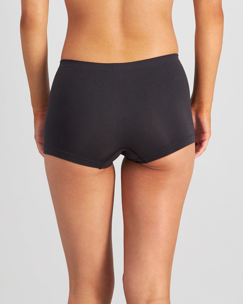 Model wears Simply Seamless Boyshort in BLACK. On body back view