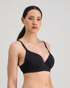 Model wears Simply Seamless Contour Bra in BLACK. On body side view