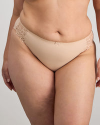 Model wears Coral High Cut Brief in LATTE. On body front view