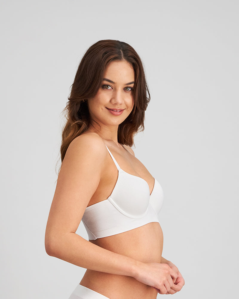 Model wears Play Contour Long Line Bra in WHITE. On body side view