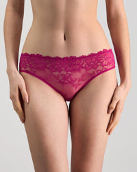 Model wears Lacey Bikini in FANTASY FUCHSIA. On body front view