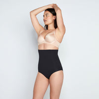 Model wears Medium Control High Waisted Brief in BLACK. On body side view