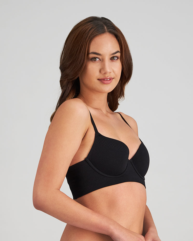 Model wears Play Contour Long Line Bra in BLACK. On body side view