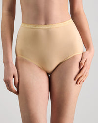 Model wears Freedom Full Brief in Nude. On body front view