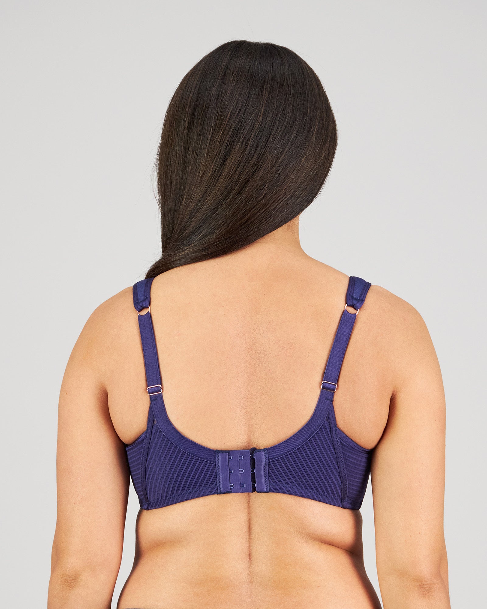 Model wears Perfect Lines Contour Bra in BLUE RIBBON. On body back view
