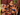 three models pose in matching navy bra and briefs on a couch
