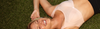 Hero banner model poses wearing sports bra in latte