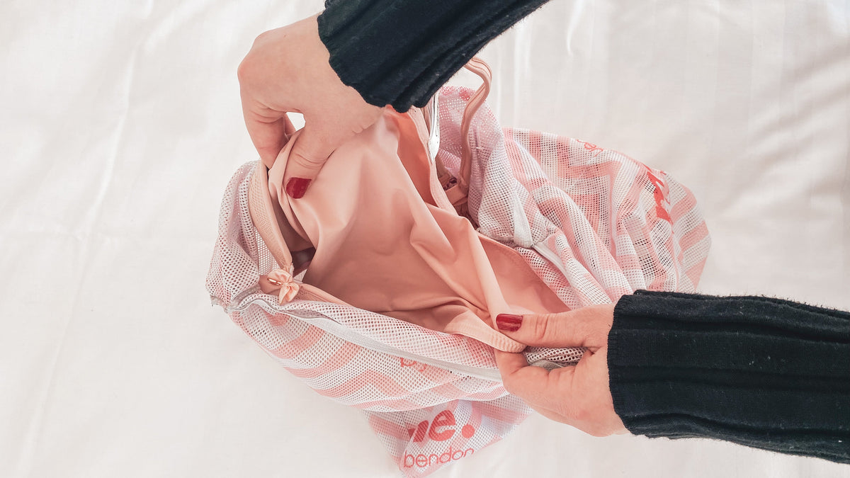 hand-holding-bra-in-lingerie-wash-bag