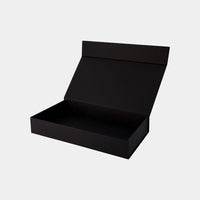 Model wears Gift Box Gift Packaging in BLACK. On body front view