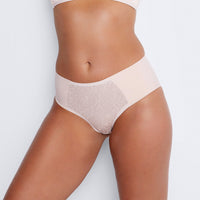 Model wears Smooth Revolution Full Brief in LATTE. On body front view