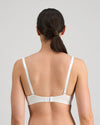 Model wears Simply Seamless Wire Free Bra in Basic Wht. On body back view