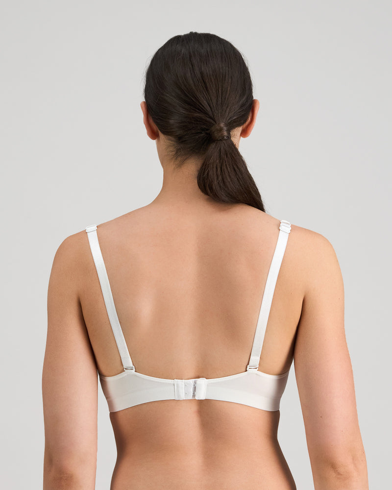 Model wears Simply Seamless Wire Free Bra in Basic Wht. On body back view