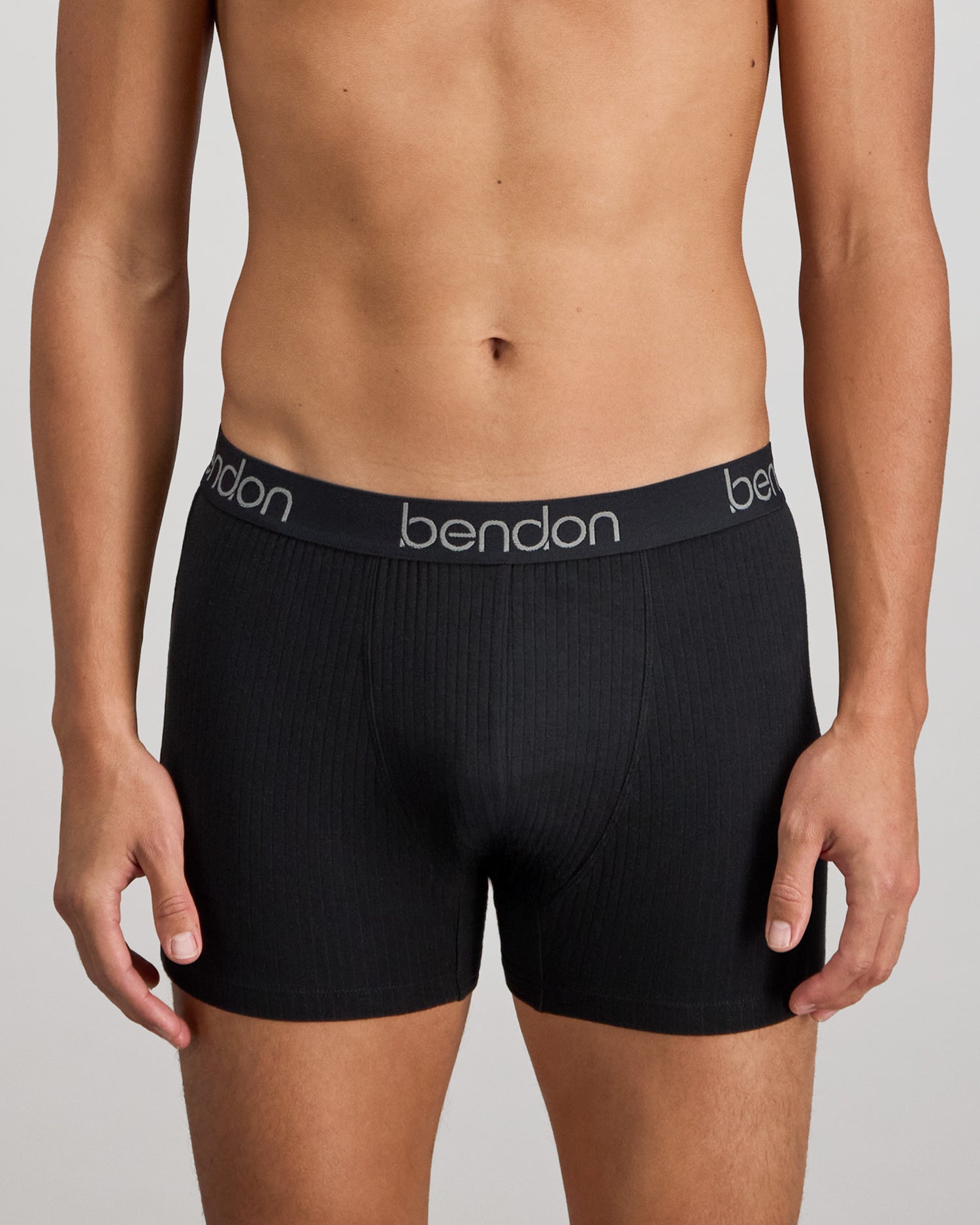 Model wears Cotton Texture Mens Trunk in BLACK. On body front view