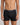 Model wears Cotton Texture Mens Trunk in BLACK. On body front view