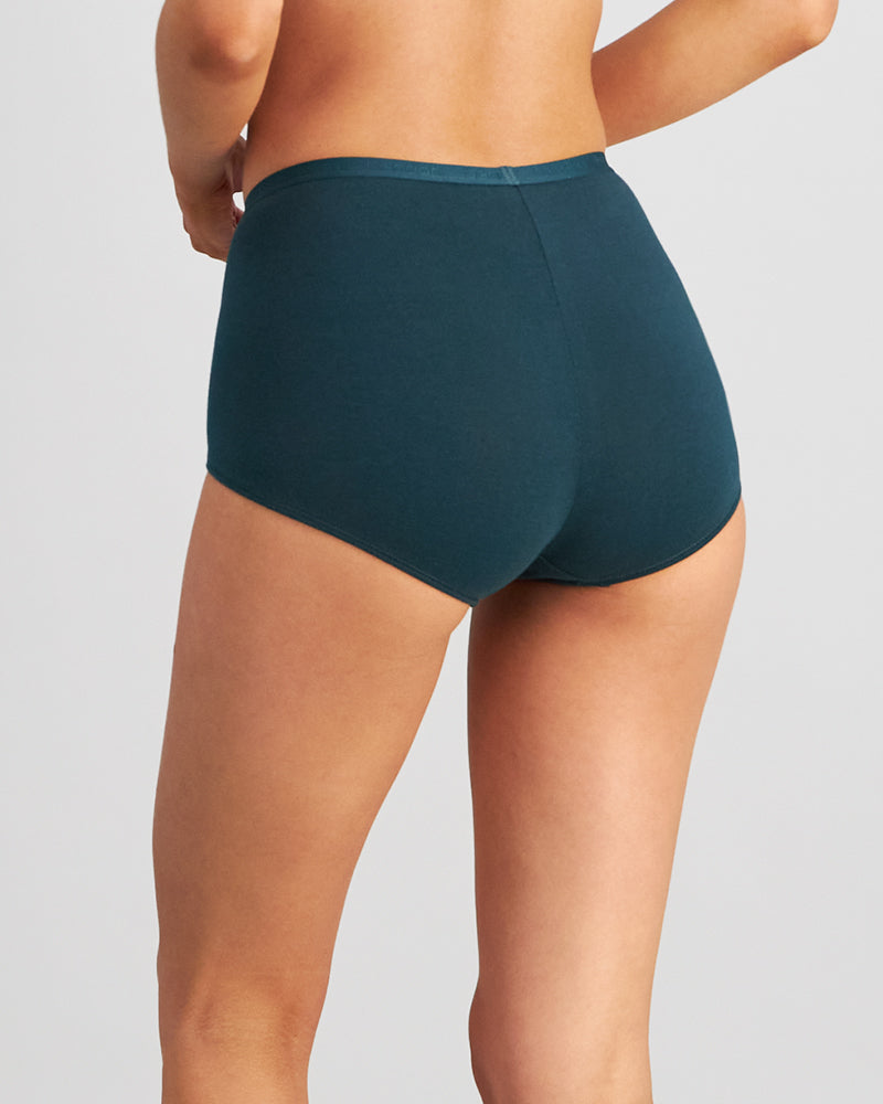 Model wears Body Cotton Full Brief in PONDEROSA PINE. On body back view