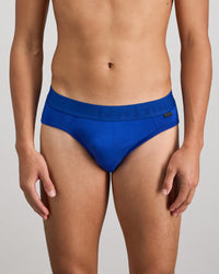 Model wears Bamboo Mens Brief in Surf The Web. On body front view