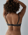 Model wears Keyhole Push Up Bra in BLACK/TOASTED ALMOND. On body back view