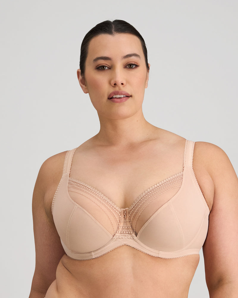Model wears Faithful Underwire Bra in LATTE. On body front view
