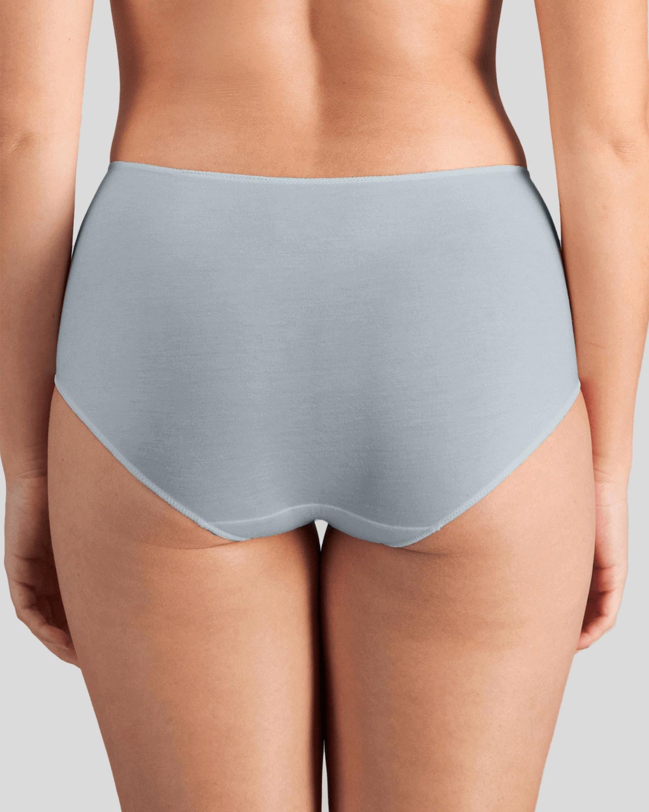 Model wears Au Naturel Full Brief in SLATE. On body back view