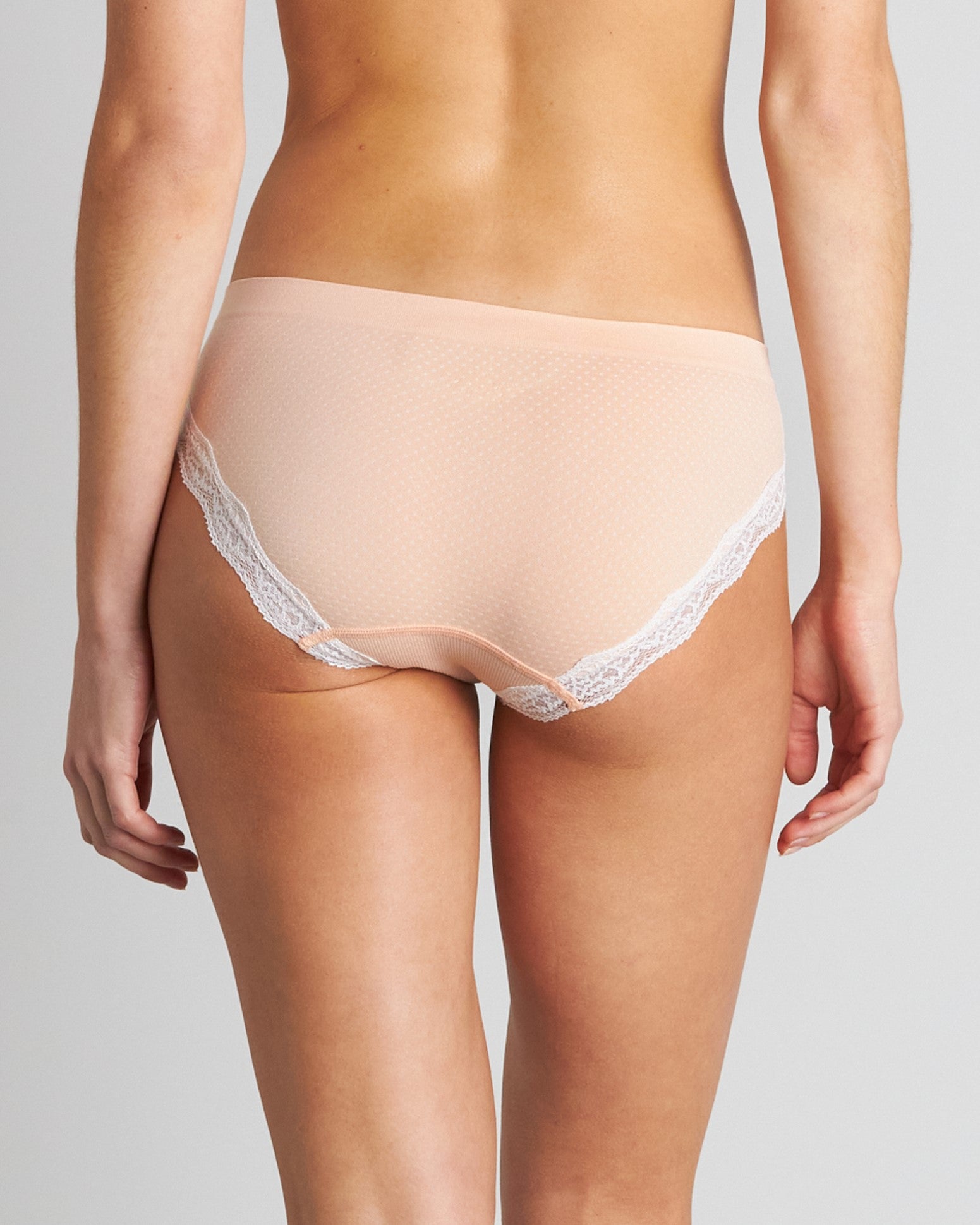 Model wears Nikki Bikini in SPANISH VILLA/WHITE. On body back view