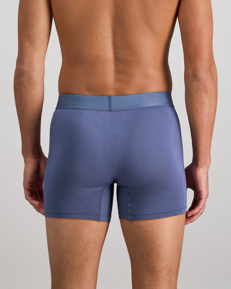 Model wears Bamboo Mens Trunk in VINTAGE INDIGO. On body back view