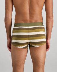 Model wears Rugby Stripe Mens Trunk in OLIVE/NUTRIA/OATMEAL. On body back view