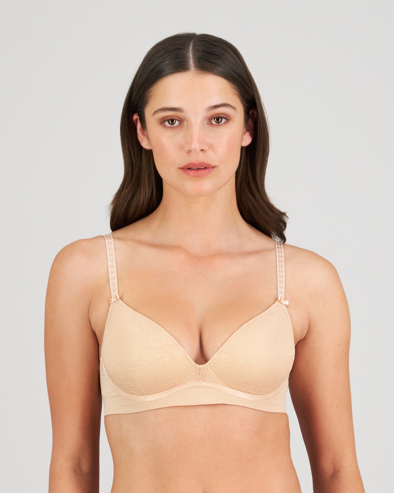 Model wears Bendon Body Lace Wire Free Bra in LATTE. On body front view