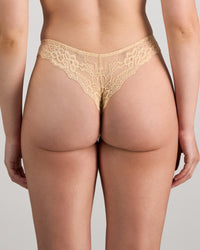 Model wears My Fit Lace Thong in FRAPPE. On body back view
