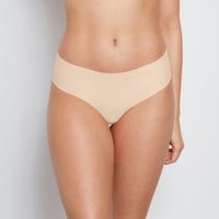 Model wears No Show Bikini in LATTE. On body front view