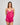 Model wears Eva Jean Short in FANTASY FUCHSIA. On body side view